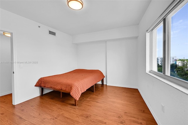 36 NW 6th Ave Unit 701, Miami, FL 33128 - bedroom featuring light wood-style floors
