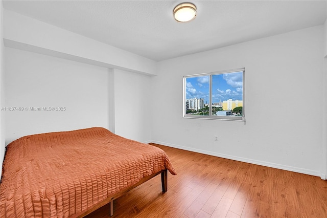 36 NW 6th Ave Unit 701, Miami, FL 33128 - bedroom featuring wood finished floors and a closet