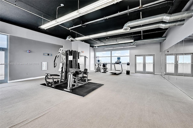 36 NW 6th Ave Unit 701, Miami, FL 33128 - gym featuring baseboards and a towering ceiling