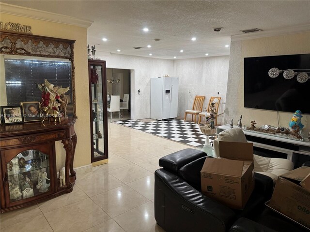 5372 W 9th Ave, Hialeah, FL 33012 - living room with ornamental molding, a textured ceiling, recessed lighting, light tile patterned floors, and a textured wall