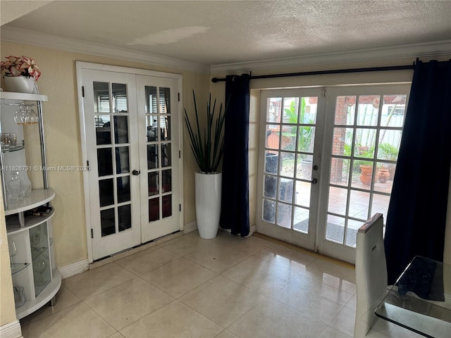 5372 W 9th Ave, Hialeah, FL 33012 - doorway with french doors, crown molding, light tile patterned floors, and a textured ceiling