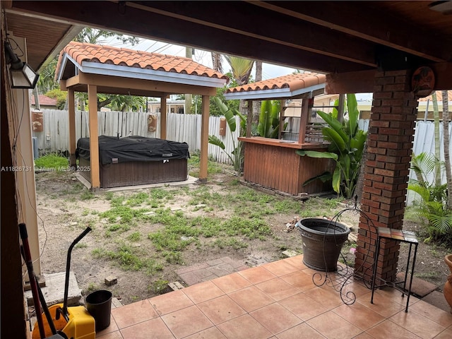 5372 W 9th Ave, Hialeah, FL 33012 - fenced backyard with a hot tub, a gazebo, and a patio