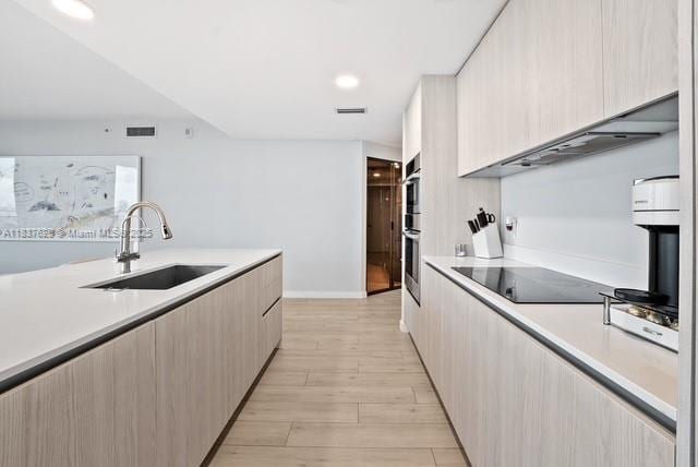 488 NE 18th St Unit 715, Miami, FL 33132 - kitchen featuring modern cabinets, black electric stovetop, light countertops, double oven, and recessed lighting
