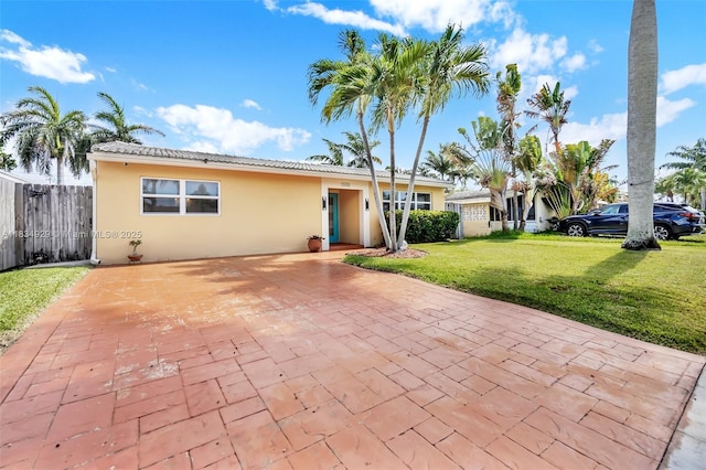 1533 Shenandoah St, Hollywood, FL 33020 - view of front facade with stucco siding, a patio, and a tile roof