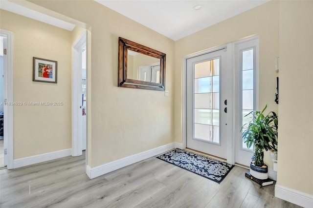 1533 Shenandoah St, Hollywood, FL 33020 - doorway featuring wood finished floors and baseboards