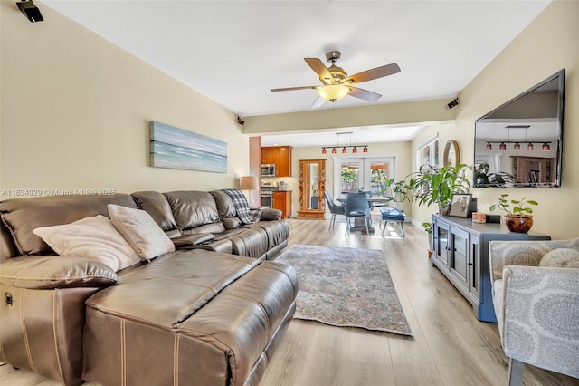 1533 Shenandoah St, Hollywood, FL 33020 - living area featuring a ceiling fan and light wood-style floors