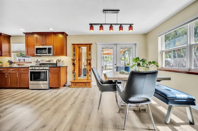 1533 Shenandoah St, Hollywood, FL 33020 - kitchen featuring stainless steel appliances, light wood-type flooring, plenty of natural light, track lighting, and recessed lighting