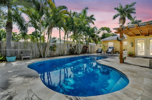 1533 Shenandoah St, Hollywood, FL 33020 - view of swimming pool featuring french doors, a patio area, and a fenced backyard