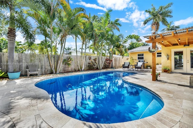 1533 Shenandoah St, Hollywood, FL 33020 - view of pool with french doors, a patio area, and a fenced backyard