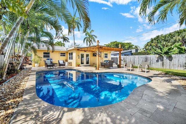 1533 Shenandoah St, Hollywood, FL 33020 - view of pool with french doors, a pergola, and a patio