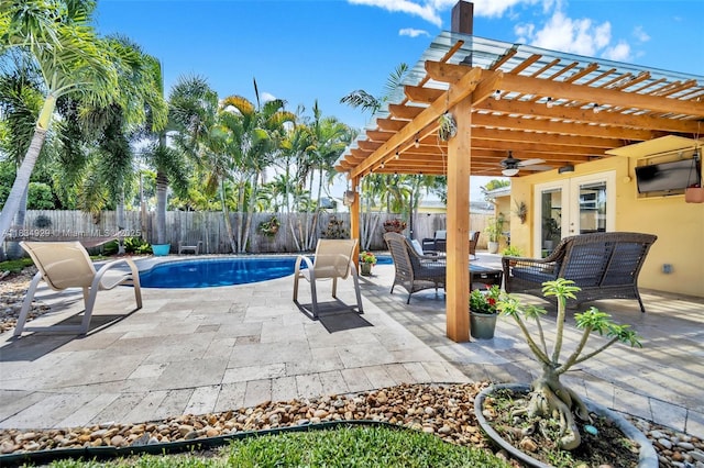 1533 Shenandoah St, Hollywood, FL 33020 - fenced backyard with french doors, a pergola, an outdoor hangout area, a patio area, and ceiling fan