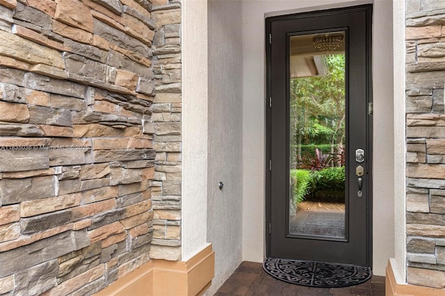 12125 S Vaquero Trails Dr, Davie, FL 33325 - view of exterior entry featuring stone siding