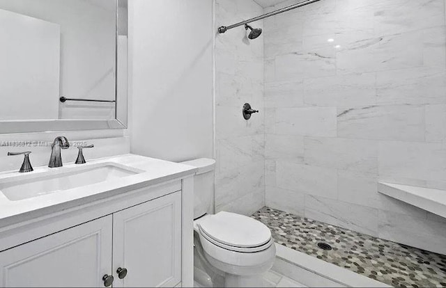103 Lake Terry Dr, West Palm Beach, FL 33411 - bathroom featuring a tile shower and vanity