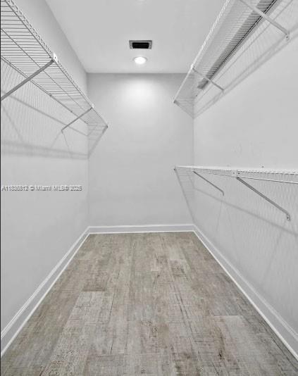 103 Lake Terry Dr, West Palm Beach, FL 33411 - spacious closet featuring wood finished floors