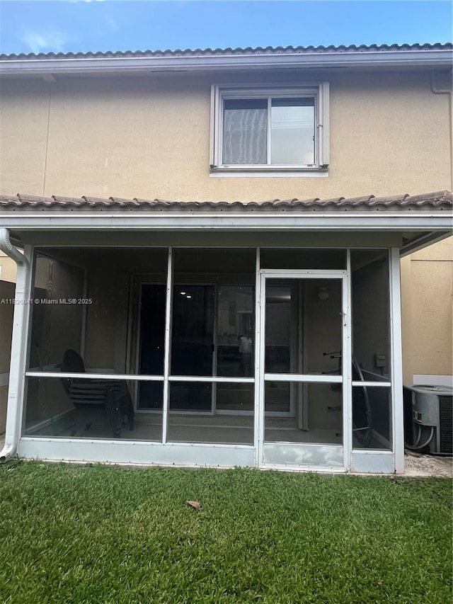 5963 Royal Way, Tamarac, FL 33321 - rear view of house featuring a sunroom and a yard