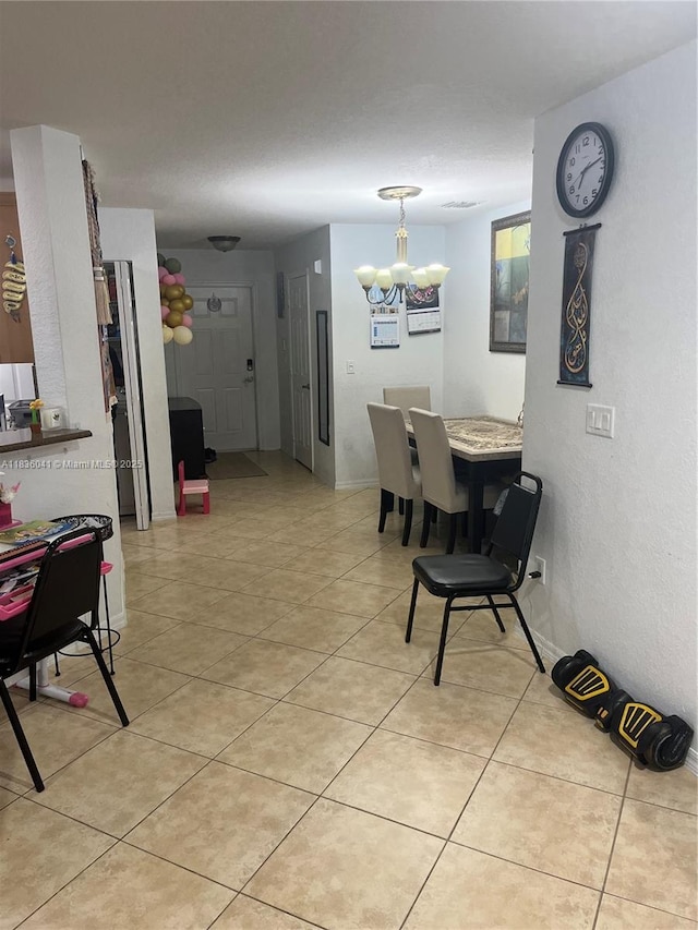 5963 Royal Way, Tamarac, FL 33321 - dining area with a chandelier, light tile patterned floors, and a textured wall