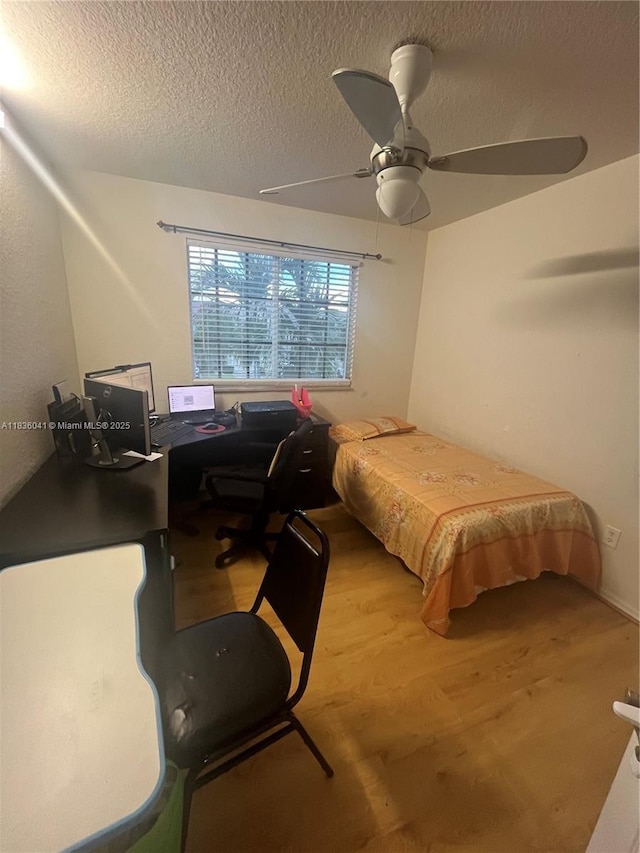 5963 Royal Way, Tamarac, FL 33321 - bedroom featuring wood finished floors, an office area, a textured ceiling, and a ceiling fan