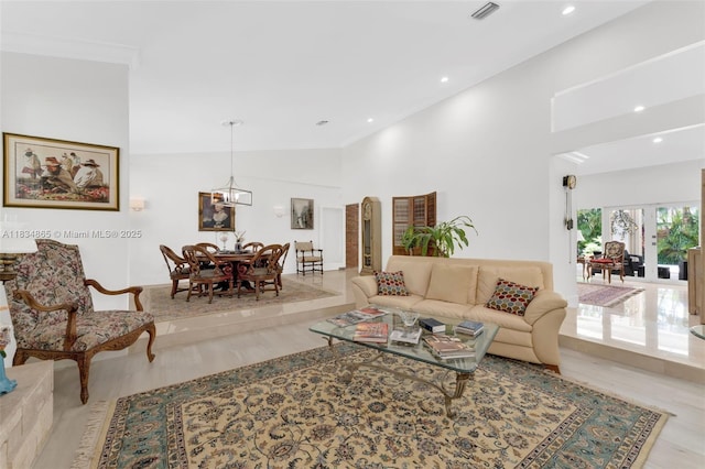 17940 SW 83rd Ave, Palmetto Bay, FL 33157 - living room with light wood-style floors, recessed lighting, and a towering ceiling