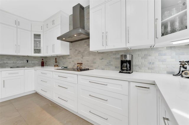 17940 SW 83rd Ave, Palmetto Bay, FL 33157 - kitchen with wall chimney exhaust hood, black electric stovetop, light countertops, and tasteful backsplash