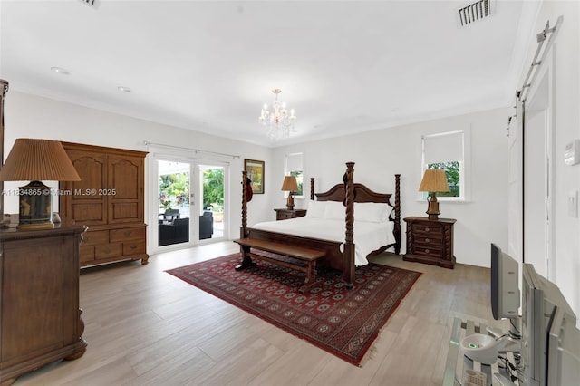 17940 SW 83rd Ave, Palmetto Bay, FL 33157 - bedroom with access to outside, a chandelier, a barn door, light wood finished floors, and french doors