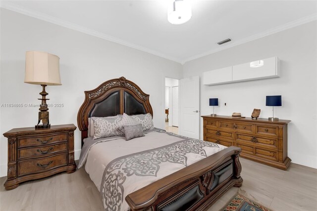 17940 SW 83rd Ave, Palmetto Bay, FL 33157 - bedroom with light wood finished floors and ornamental molding