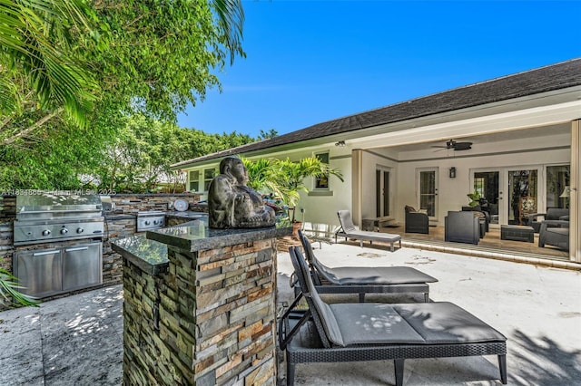 17940 SW 83rd Ave, Palmetto Bay, FL 33157 - view of patio / terrace with area for grilling, a ceiling fan, an outdoor living space, and french doors