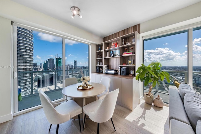 1900 N Bayshore Dr Unit 4111, Miami, FL 33132 - dining area featuring light wood finished floors and a view of skyline