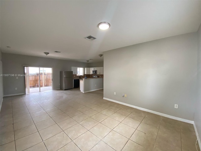 6124 SW 39th St, Miramar, FL 33023 - unfurnished living room with light tile patterned floors and baseboards