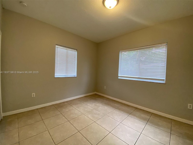 6124 SW 39th St, Miramar, FL 33023 - unfurnished room with light tile patterned flooring and a smoke detector