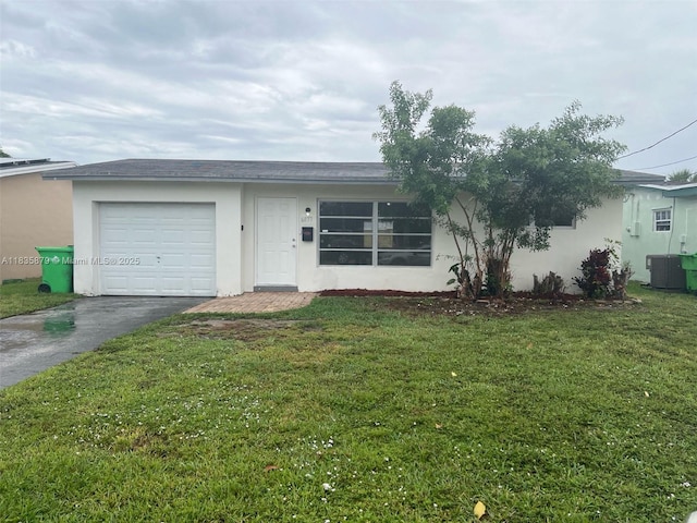 6837 NW 28th St, Sunrise, FL 33313 - ranch-style home featuring asphalt driveway, stucco siding, a front yard, and a garage