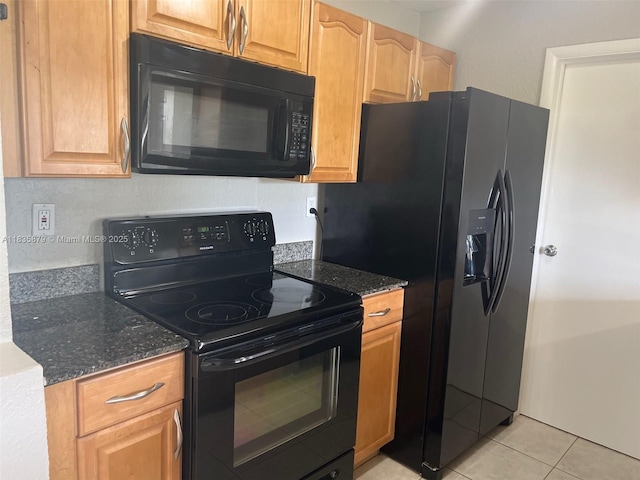 6837 NW 28th St, Sunrise, FL 33313 - kitchen with black appliances, light tile patterned floors, and dark stone countertops