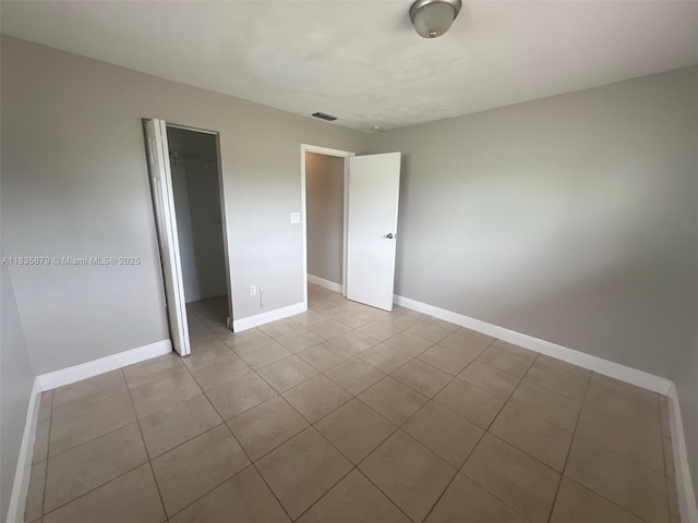 6837 NW 28th St, Sunrise, FL 33313 - unfurnished bedroom featuring tile patterned flooring and a closet