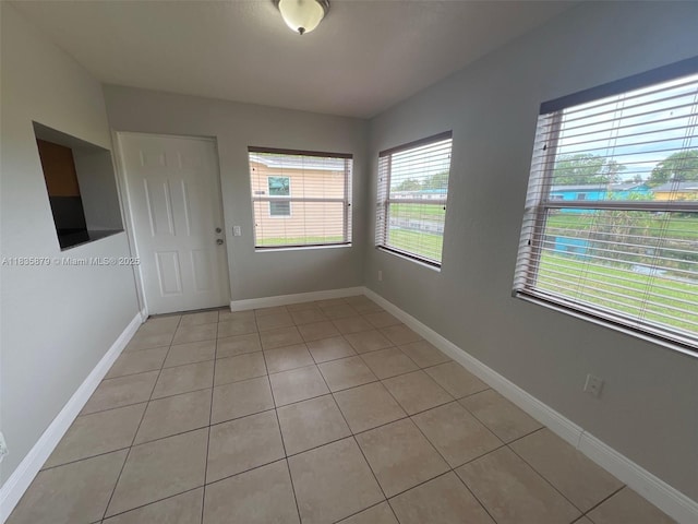 6837 NW 28th St, Sunrise, FL 33313 - spare room featuring light tile patterned floors and baseboards