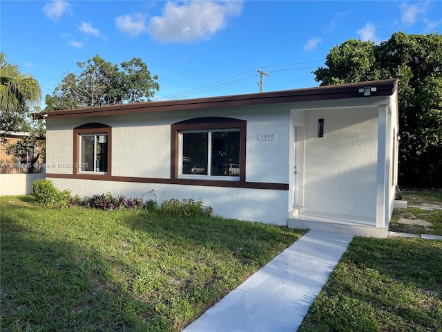 1310 Sharazad Blvd, Opa Locka, FL 33054 - ranch-style house with a front lawn