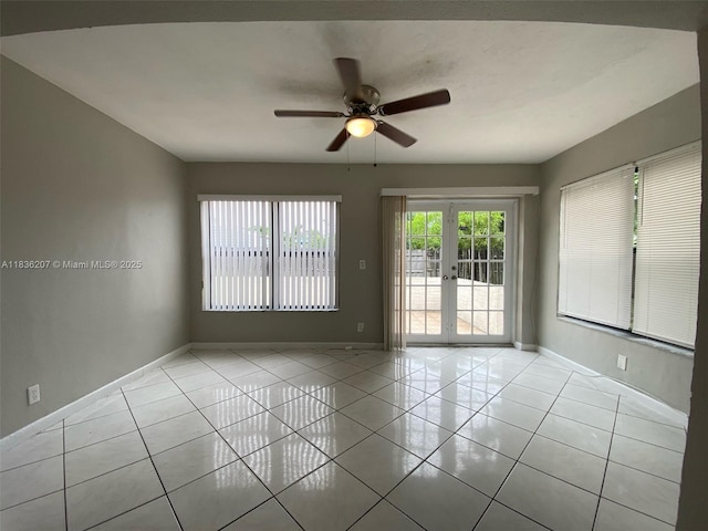 7521 Indigo St, Miramar, FL 33023 - spare room with tile patterned floors, french doors, and a ceiling fan