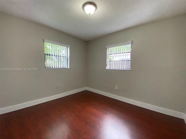 7521 Indigo St, Miramar, FL 33023 - empty room with plenty of natural light and dark wood-type flooring