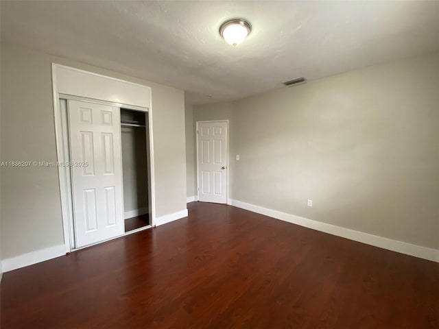 7521 Indigo St, Miramar, FL 33023 - unfurnished bedroom with wood finished floors and a closet