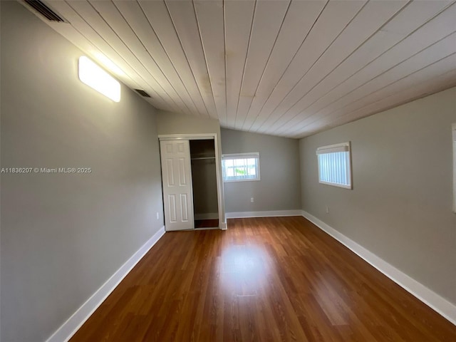 7521 Indigo St, Miramar, FL 33023 - unfurnished bedroom featuring dark wood-style flooring, vaulted ceiling, a closet, and wood ceiling