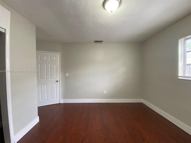 7521 Indigo St, Miramar, FL 33023 - spare room with baseboards and dark wood finished floors