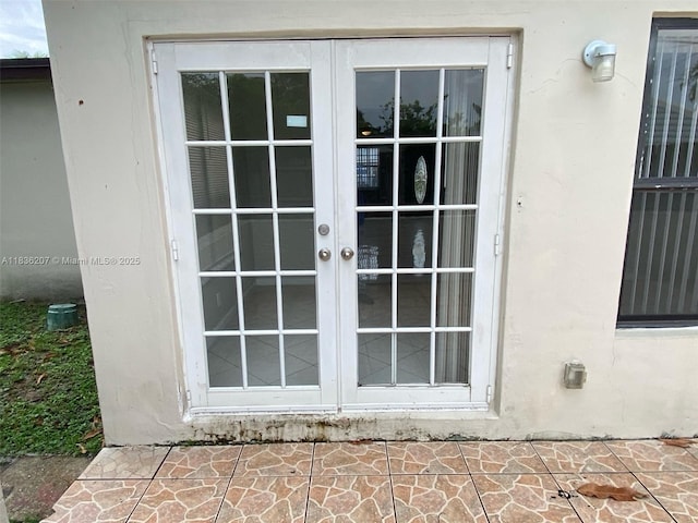 7521 Indigo St, Miramar, FL 33023 - property entrance featuring french doors and stucco siding