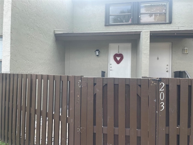 10020 NW 9th St Cir Unit 203, Miami, FL 33172 - doorway to property with stucco siding