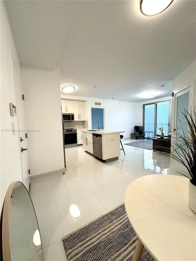 2651 NE 212th Ter Unit 202, Aventura, FL 33180 - living area with light tile patterned floors