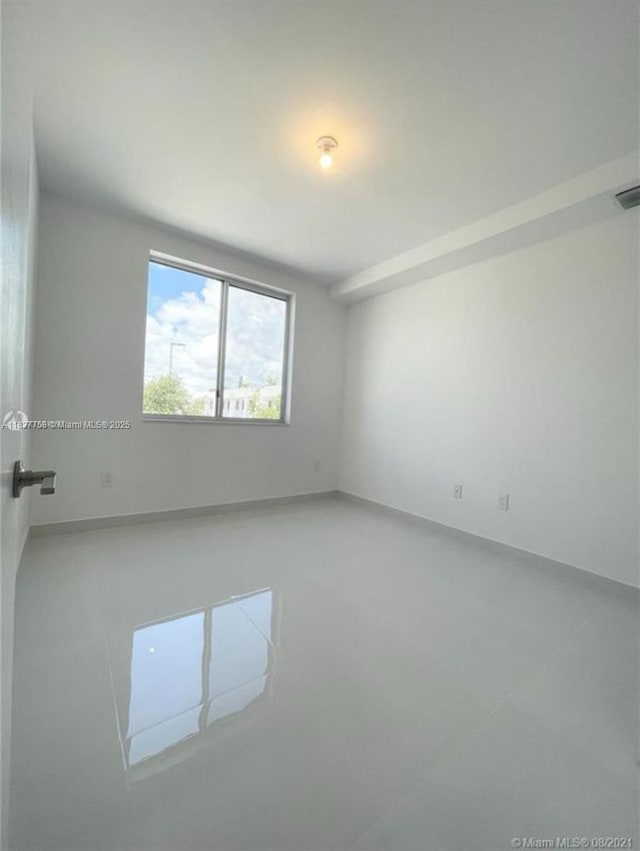 2651 NE 212th Ter Unit 202, Aventura, FL 33180 - unfurnished room with tile patterned floors