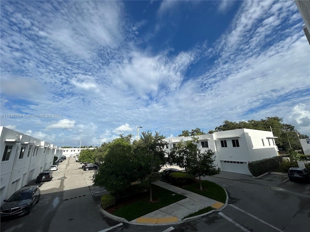 2651 NE 212th Ter Unit 202, Aventura, FL 33180 - view of asphalt road featuring curbs