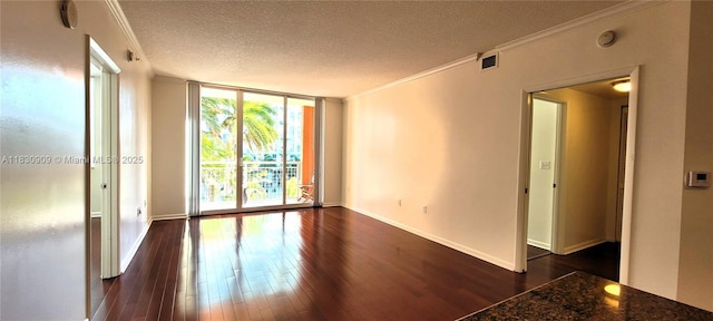 2000 N Bayshore Dr Unit 509, Miami, FL 33137 - spare room with ornamental molding, a textured ceiling, dark wood-style floors, a smoke detector, and expansive windows