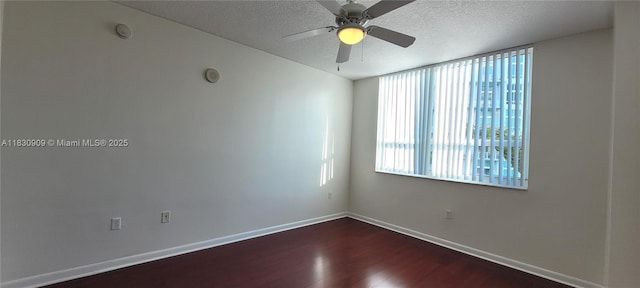 2000 N Bayshore Dr Unit 509, Miami, FL 33137 - empty room with dark wood finished floors, a textured ceiling, ceiling fan, and a smoke detector