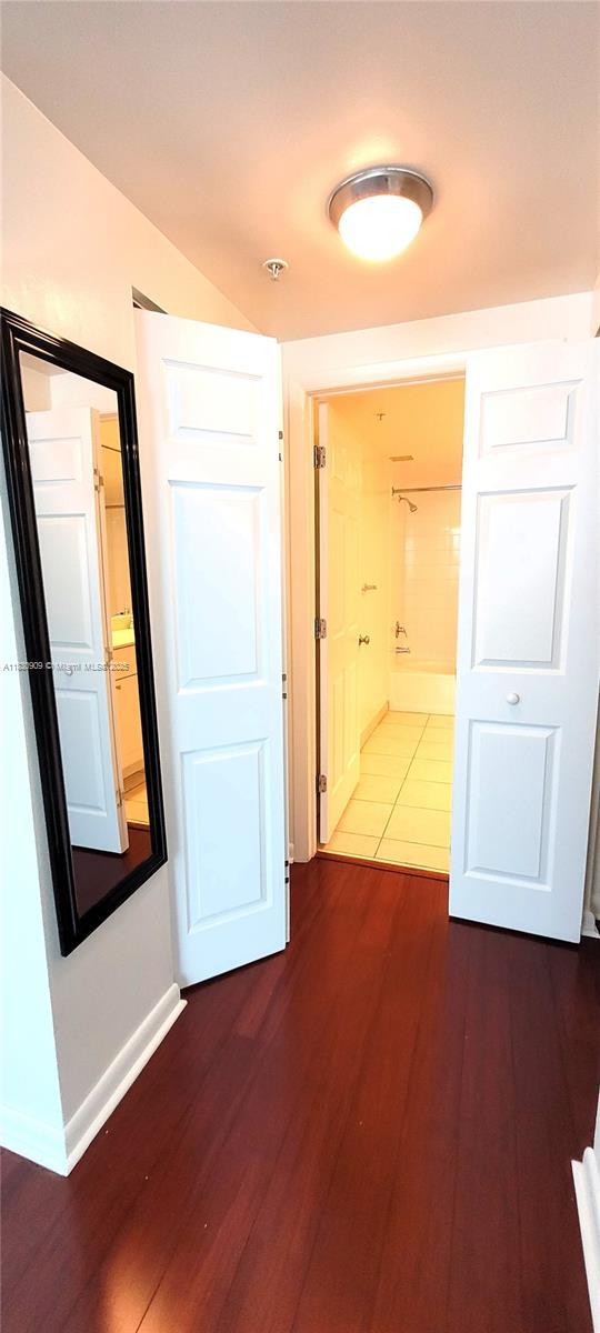 2000 N Bayshore Dr Unit 509, Miami, FL 33137 - hallway featuring wood finished floors and baseboards