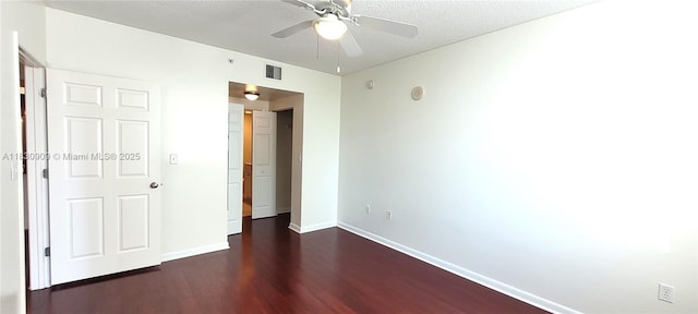 2000 N Bayshore Dr Unit 509, Miami, FL 33137 - unfurnished bedroom featuring dark wood finished floors, ceiling fan, and a textured ceiling