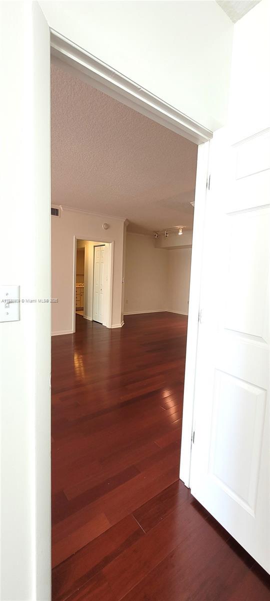 2000 N Bayshore Dr Unit 509, Miami, FL 33137 - hallway featuring wood finished floors and a textured ceiling