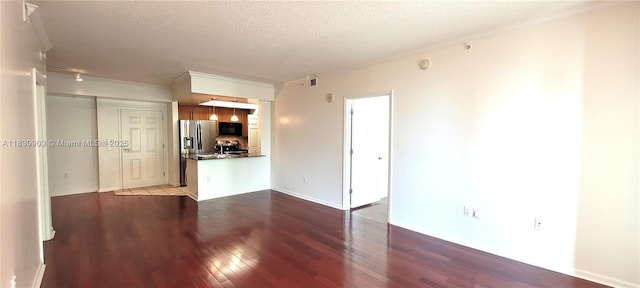 2000 N Bayshore Dr Unit 509, Miami, FL 33137 - unfurnished living room featuring dark wood-type flooring, a textured ceiling, and ornamental molding